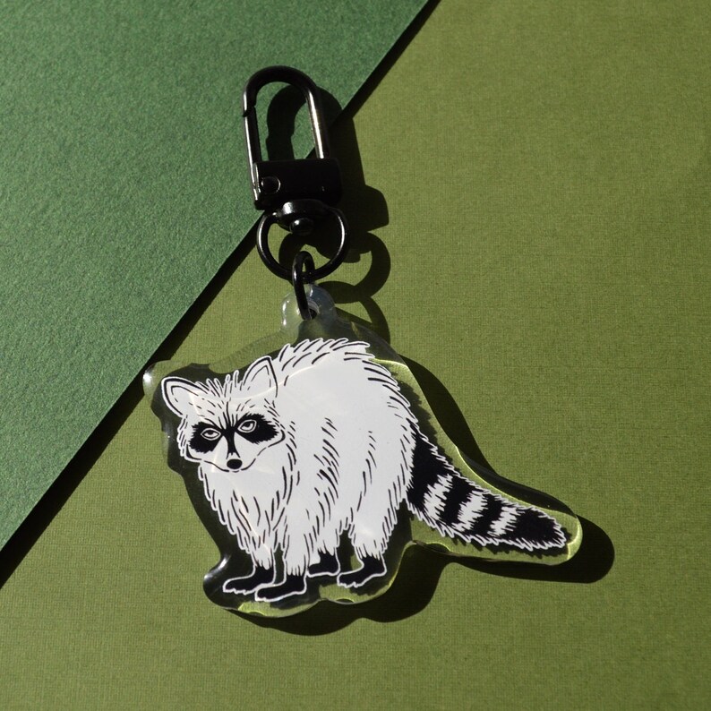 Raccoon, trash panda, key chain, drawing, illustration, olive green, black, ink, illustration, metal, Florida, wildlife art