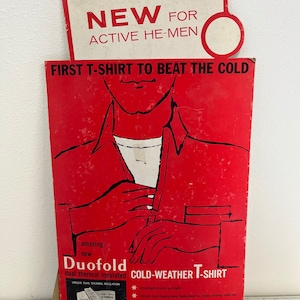 T-shirt vintage Duofold pour temps froid, affiche en carton pour présentation en magasin avec voyageur inutilisé