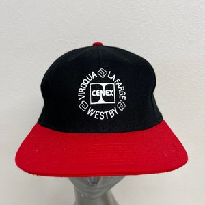 May include: Black and red baseball cap with a white embroidered logo that reads "IROQUOIS LAFARGE CENEX WESTBY".