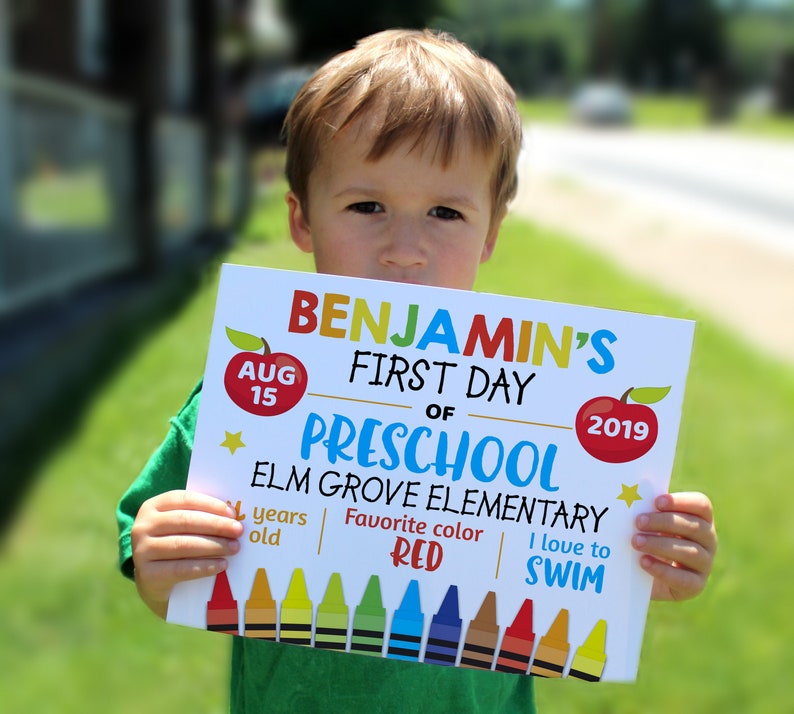 child holding Editable First day of school sign personalized school sign 