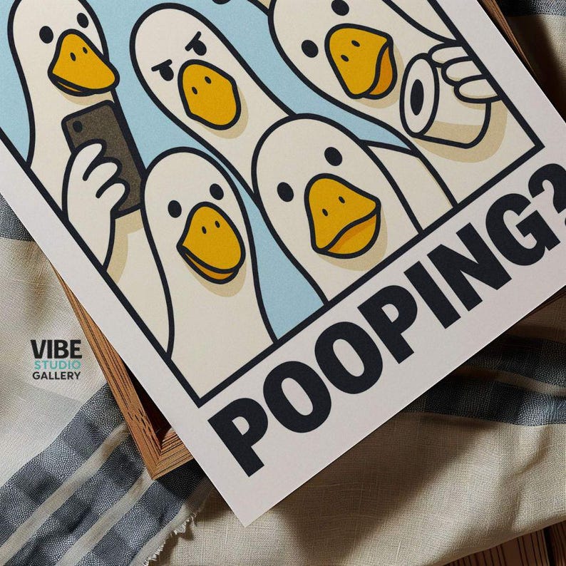 May include: A print featuring cartoon ducks with yellow beaks and black eyes. One duck holds a phone, another a roll of toilet paper. The word "POOPING?" is printed in bold black letters.