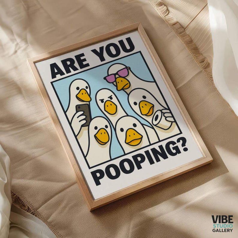 May include: Framed art print featuring a cartoon illustration of several white ducks with yellow beaks. The ducks are depicted in various poses, with one wearing sunglasses and another holding a phone. The text "ARE YOU POOPING?" is displayed in bold letters.