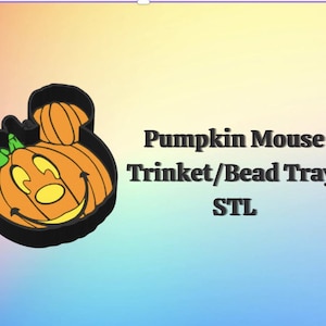 May include: An orange pumpkin-shaped trinket tray in the form of a mouse head, with a black outline and green leaf. The text reads "Pumpkin Mouse Trinket/Bead Tray STL". Ideal for Halloween or autumn decor.