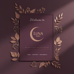May include: A framed sign with the text "Welcome to Luna Bar" and a crescent moon logo. The sign is surrounded by bronze-colored leaves and berries on a dark burgundy background. The sign also says "Where night meets flavor."