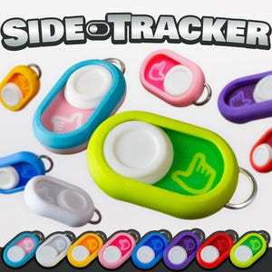 May include: A collection of colorful Side Tracker keychains in various colors, including blue, pink, yellow, green, and purple. Each keychain features a white button and a metal ring for attachment. The text "SIDE TRACKER" is displayed at the top.