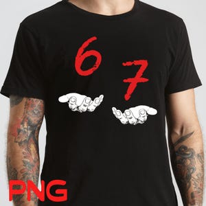 Puede incluir: Camiseta negra con los números rojos "6" y "7" sobre dos manos blancas. Las manos están ilustradas con detalle, con las palmas abiertas. El diseño es sencillo y llamativo.