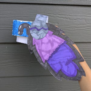 cute round base gaming dragon, purple blue, and black, with headphones