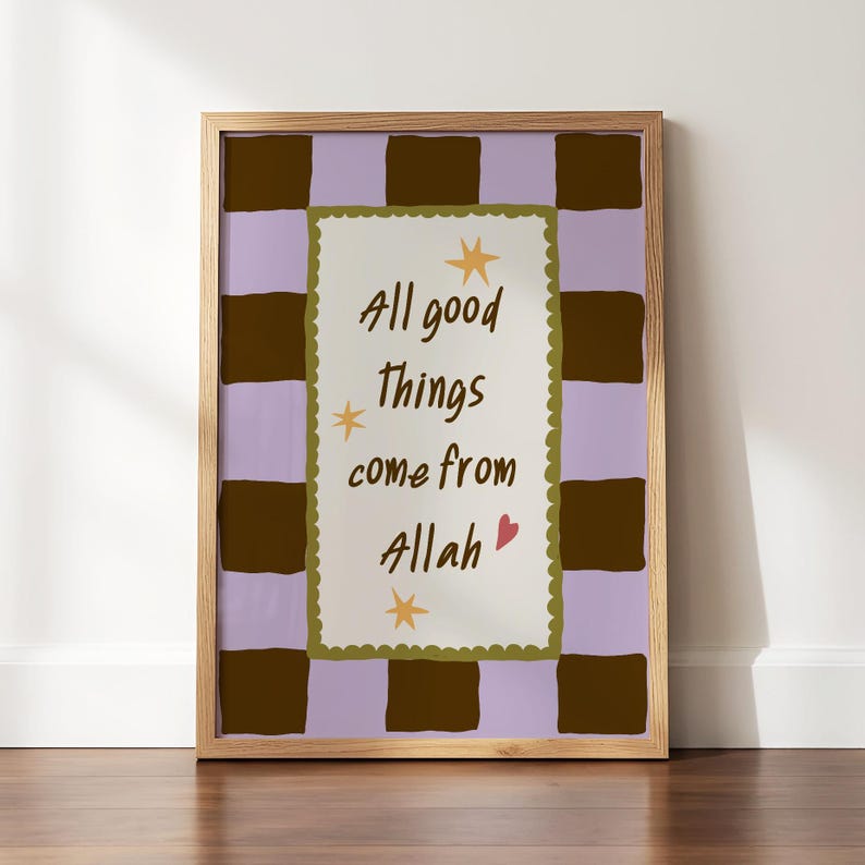 May include: A framed rectangular wall art print featuring a light purple and dark brown checkered background. The center contains a cream-colored rectangle with a scalloped olive green border, the text All good things come from Allah, three yellow stars, and a small red heart.