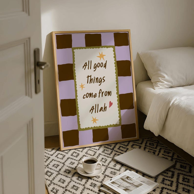 May include: A framed rectangular wall art print featuring a light purple and dark brown checkerboard pattern. The center contains a white scalloped rectangle with the text All good things come from Allah, accented by yellow stars and a small red heart.