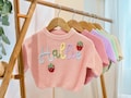 Personalized Christmas Baby Jumper | Hand-Embroidered Name Sweater | Custom Gift for Newborn, Baby Shower or 1st Birthday product logo