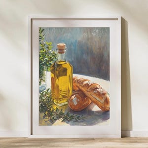 Könnte beinhalten: Ein gerahmter Kunstdruck mit einem realistischen Gemälde einer klaren Glasflasche gefüllt mit goldenem Olivenöl, verschlossen mit einem Korken, neben zwei knusprigen Brotlaiben und grünen Zweigen. Der Text Maison-MehyArt ist zu sehen.
