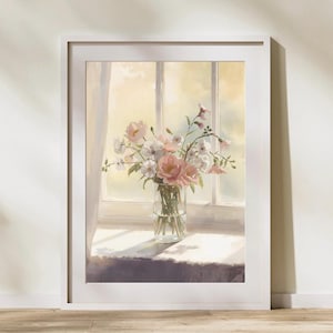 Könnte beinhalten: Ein gerahmter Kunstdruck mit einem Gemälde einer klaren Glasvase voller rosa und weißer Blumen auf einem Fensterbrett. Die Szene zeigt weiches natürliches Licht, das durch ein Fenster mit Vorhängen fällt. Der Text lautet Maison-MehyArt.