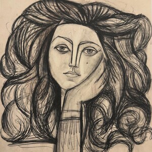 May include: A charcoal sketch of a woman's face with long, flowing hair. The woman's hand rests on her cheek. The artwork is done in a minimalist style with a focus on lines and shading, creating a classic, elegant portrait.