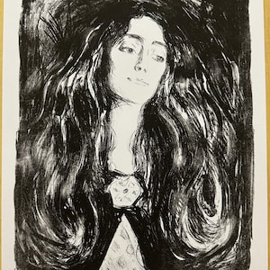May include: Black and white print of a woman with long, flowing hair. The artwork features a detailed portrait with a floral design on the chest. The print is numbered 220/350 and signed by the artist, Edvard Munch.