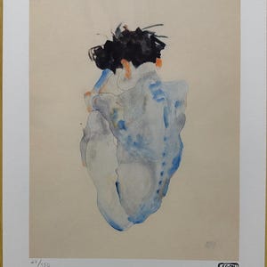May include: A watercolor print of a figure from the back, with black hair and blue and gray shading. The artwork is on a cream-colored background, with the text "27/150" and the artist's signature in the lower right corner.