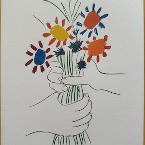 May include: A print depicting a bouquet of flowers held by two hands. The flowers are in red, orange, yellow, and blue, with green stems and leaves. The artwork is signed and numbered 23/350.