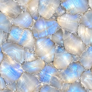 May include: A mosaic surface composed of polished, irregular moonstone fragments. Each stone displays a translucent, milky white appearance with iridescent blue flashes. The stones are joined together by thin, silver-coloured metallic grout lines.