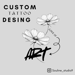 May include: A custom tattoo design featuring two detailed white cosmos flowers with the words "LOVE IS ART" and "CUSTOM TATTOO DESIGN" in black script. The design is on a light gray background.