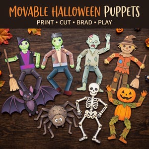 Peut inclure: Un ensemble de marionnettes d'Halloween articulées en papier représentant une sorcière, le monstre de Frankenstein, un zombie, un épouvantail, une chauve-souris, une araignée, un squelette et une citrouille. Le texte indique MOVABLE HALLOWEEN PUPPETS.