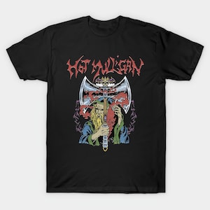 May include: Black t-shirt featuring a graphic of a bearded figure holding a double-bladed axe. The axe has a crown on top and is surrounded by red and purple accents. The text "HOT VULCAN" is displayed above the axe in red.