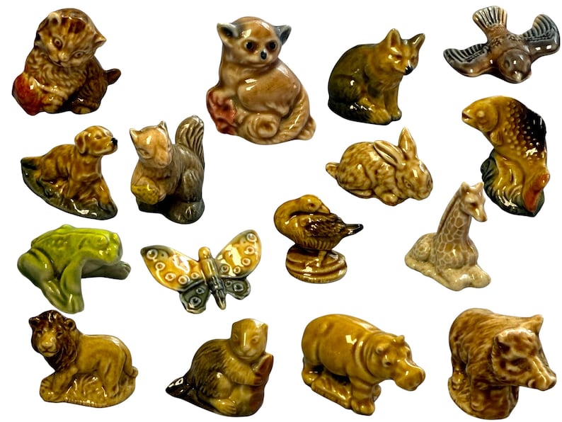 Cluster of tiny hand-glazed porcelain animals in earthy glazes, vintage Wade Whimsies animal figurines arranged