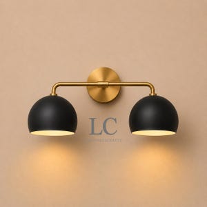 double wall sconce
brass vanity light
modern wall fixture
dual arm wall light
bathroom wall light
mid century light
vanity light brass
minimalist light
wall light fixture
home decor light
luxury wall light
vanity light
colorful sconce
vanity light, wall sconce, handcrafted light, modern vanity light, handmade lamp, brass wall sconce, dome shade light, triple vanity light, minimalist lighting, brass light, 3 light sconce, mid-century light, bathroom  fixture