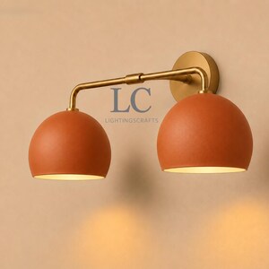 double wall sconce
brass vanity light
modern wall fixture
dual arm wall light
bathroom wall light
mid century light
vanity light brass
minimalist light
wall light fixture
home decor light
luxury wall light
vanity light
colorful sconce
vanity light, wall sconce, handcrafted light, modern vanity light, handmade lamp, brass wall sconce, dome shade light, triple vanity light, minimalist lighting, brass light, 3 light sconce, mid-century light, bathroom  fixture