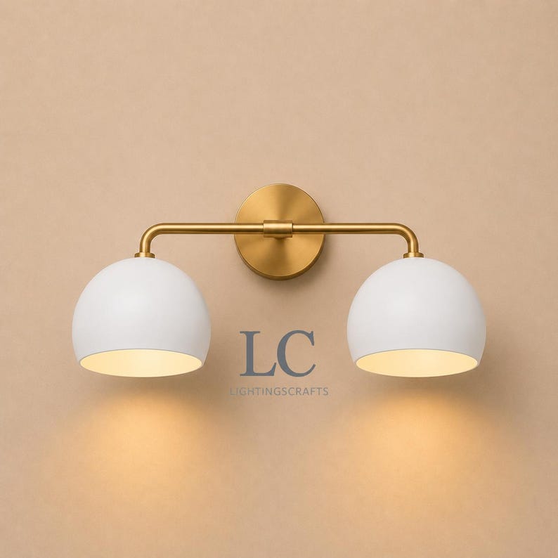 double wall sconce
brass vanity light
modern wall fixture
dual arm wall light
bathroom wall light
mid century light
vanity light brass
minimalist light
wall light fixture
home decor light
luxury wall light
vanity light
colorful sconce
vanity light, wall sconce, handcrafted light, modern vanity light, handmade lamp, brass wall sconce, dome shade light, triple vanity light, minimalist lighting, brass light, 3 light sconce, mid-century light, bathroom  fixture