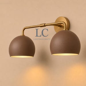 double wall sconce
brass vanity light
modern wall fixture
dual arm wall light
bathroom wall light
mid century light
vanity light brass
minimalist light
wall light fixture
home decor light
luxury wall light
vanity light
colorful sconce
vanity light, wall sconce, handcrafted light, modern vanity light, handmade lamp, brass wall sconce, dome shade light, triple vanity light, minimalist lighting, brass light, 3 light sconce, mid-century light, bathroom  fixture