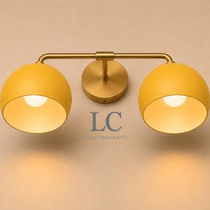 double wall sconce
brass vanity light
modern wall fixture
dual arm wall light
bathroom wall light
mid century light
vanity light brass
minimalist light
wall light fixture
home decor light
luxury wall light
vanity light
colorful sconce
vanity light, wall sconce, handcrafted light, modern vanity light, handmade lamp, brass wall sconce, dome shade light, triple vanity light, minimalist lighting, brass light, 3 light sconce, mid-century light, bathroom  fixture