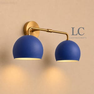 double wall sconce
brass vanity light
modern wall fixture
dual arm wall light
bathroom wall light
mid century light
vanity light brass
minimalist light
wall light fixture
home decor light
luxury wall light
vanity light
colorful sconce
vanity light, wall sconce, handcrafted light, modern vanity light, handmade lamp, brass wall sconce, dome shade light, triple vanity light, minimalist lighting, brass light, 3 light sconce, mid-century light, bathroom  fixture
