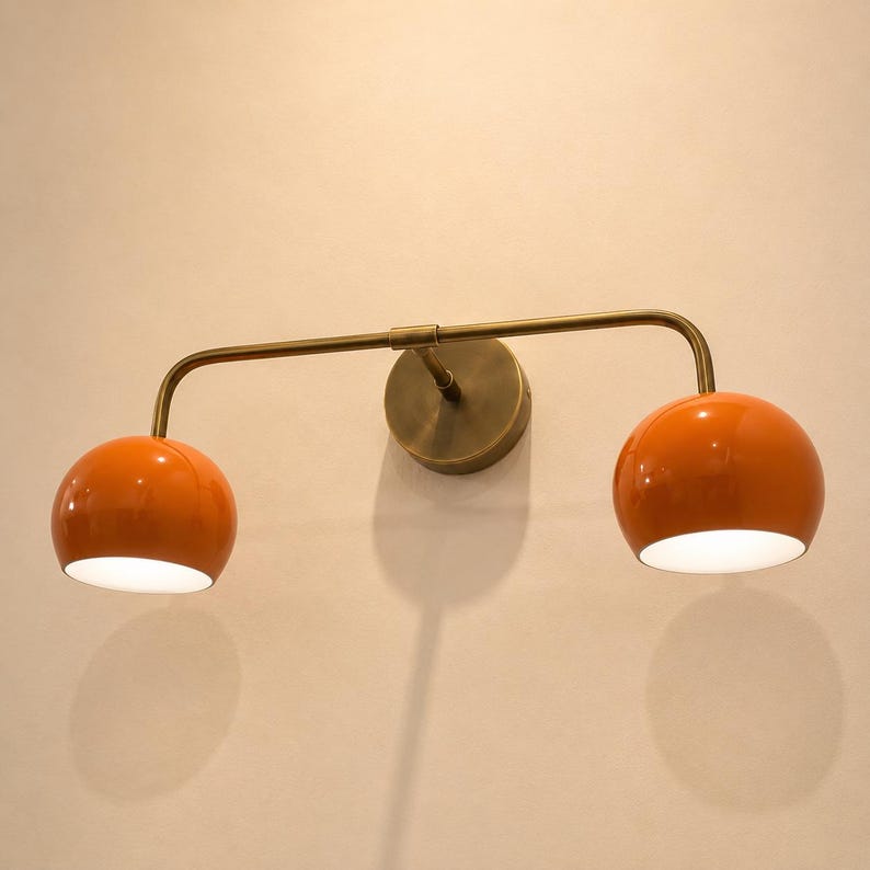 double wall sconce
brass vanity light
modern wall fixture
dual arm wall light
bathroom wall light
mid century light
vanity light brass
minimalist light
wall light fixture
home decor light
luxury wall light
orange Wall Light
Orange Sconce
vanity wall sconce, wall mounted sconce, flush mount sconce, bathroom Bedroom wall Sconce, Dome Shade Light, Double Arm Sconce, Reading Light, Wall Fixture Lamp, Italian wall Sconce, hallway Wall Sconce, Double Arm Fixture, Brass Wall Sconce, Modern Wall Lamp