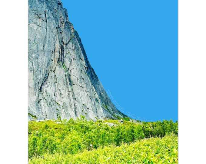 Granite Mountain Towers Above Verdant Green Forest Against Brilliant Blue Sky