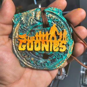 Goonies larger glow in the dark Doubloon Pendant colored.