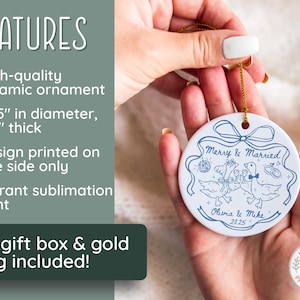 May include: A white ceramic ornament with a blue illustration of two geese toasting, with the text "Merry & Married" and the names "Olivia & Mike 2025". The ornament is 2.85 inches in diameter and 1/8 inch thick.