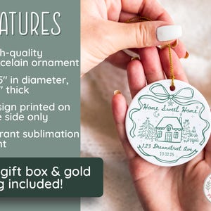 May include: A white porcelain ornament with a green illustration and text. The ornament is 2.85 inches in diameter and 1/8 inch thick. The design features a house, trees, and the words "Home Sweet Home". Includes a gold string.