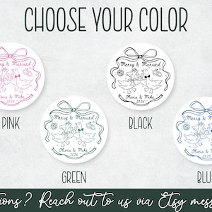 May include: Circular wedding stickers with a cartoon goose design in pink, black, green, and blue. Each sticker has the text "Merry & Married" and the names "Olivia & Mike 2025". The image also includes the text "Choose Your Color".