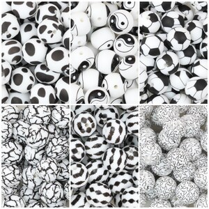 May include: A collection of six distinct groups of round beads, each featuring a unique black and white pattern including cow spots, yin-yang symbols, soccer ball designs, marble-like cracks, geometric shapes, and stethoscope illustrations.
