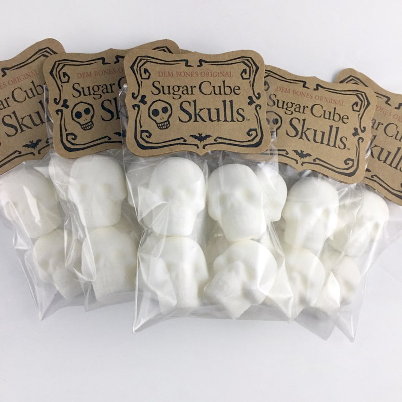 5 Bags of Skull sugar cubes on white background, Kraft labels read: DemBones Original Sugar Cube Skulls