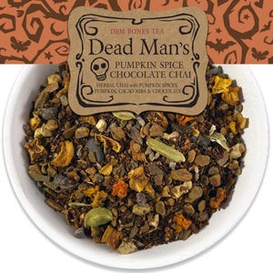 May include: A white bowl filled with a blend of herbal chai tea. The tea includes pumpkin spices, cacao nibs, and chocolate. A brown label reads "Dead Man's Pumpkin Spice Chocolate Chai". The background has a Halloween-themed pattern.