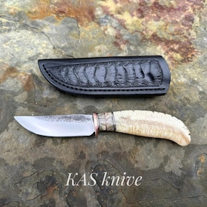 Custom Handmade Hunting knife with Beautiful leather cover. Made of high quality carbon Steel with Stabilized Musk Ox Boss Handle.
