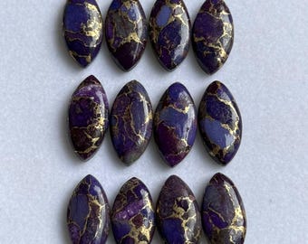 May include: Twelve oval-shaped gemstones with a deep purple base color and gold veining. The stones are arranged in three rows of four, showcasing their polished surfaces and unique patterns. The gemstones are likely for jewelry making.
