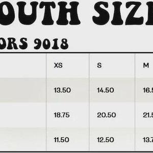 May include: A youth apparel size chart with measurements in inches. Sizes range from XS to XL, detailing width, length, and sleeve length from the center back. The chart is labeled "YOUTH SIZE" and "COMFORT COLORS 9018". Measurements are provided in inches.
