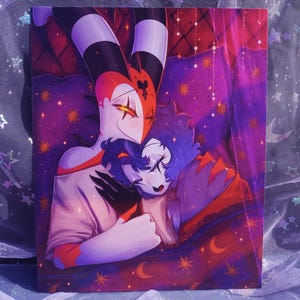 May include: A vibrant illustration depicts two cartoon characters embracing. One character has a white face with red and black accents, the other has blue fur. The background is a mix of purple, pink, and orange with stars and crescent moons.