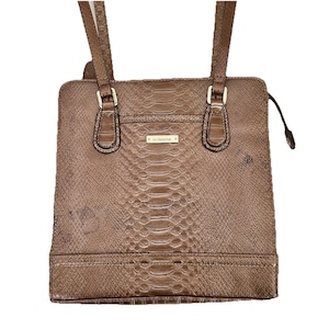 May include: A brown, faux snakeskin handbag with two top handles and a rectangular shape. The bag features gold-toned hardware and a small rectangular tag that reads "st. claiborne."