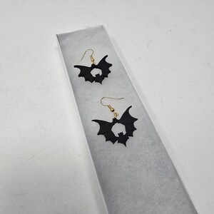 Bat earrings in black and gold