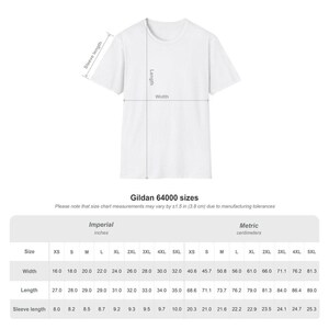 May include: A white Gildan 64000 t-shirt with measurements displayed in inches. The size chart shows width, length, and sleeve length measurements for sizes XS to 5XL. The width ranges from 16.0 to 32.0 inches.