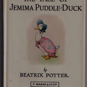 May include: A book cover for "The Tale of Jemima Puddle-Duck" by Beatrix Potter. The cover shows a duck in a bonnet and shawl. The book is published by F. Warne & Co Ltd. The title is in a decorative font.