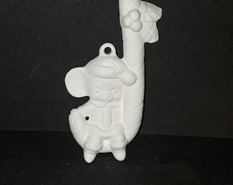 Mouse sitting on candy cane