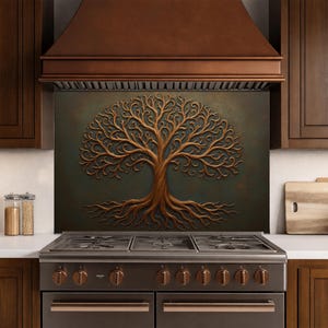 May include: A rectangular kitchen backsplash panel featuring a raised, metallic copper-colored tree of life design with intricate, swirling branches and roots set against a dark, textured, matte green background, positioned behind a stainless steel stove.